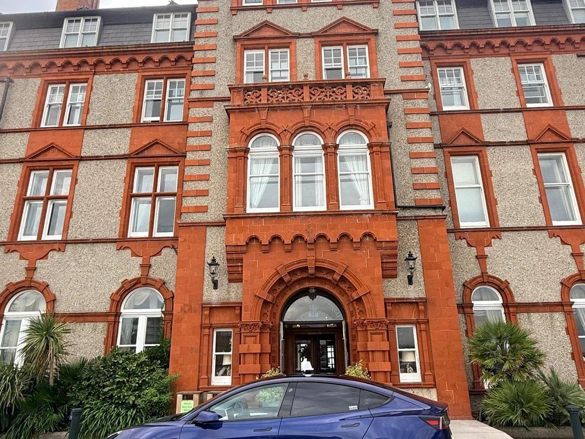 ZensCars Tesla parked at a Newquay seafront hotel